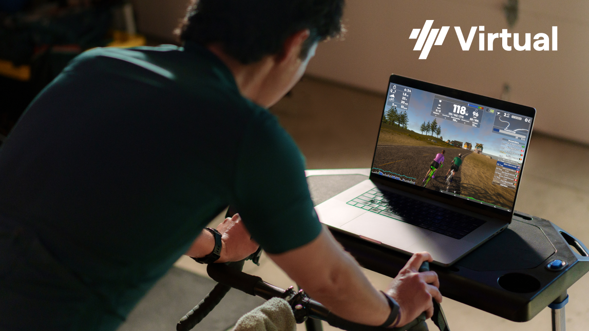 Trainingpeaks Virtual Bloc Male Cyclist On Indoor Trainer Cycling In Front Of Laptop With Trainingpeaks Virtual