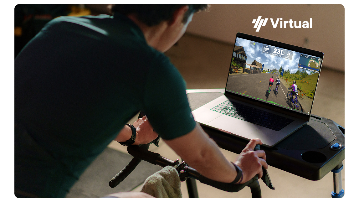 Virtual Male Cyclist On Trainer With Trainingpeaks Virtual On Laptop